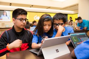 Students at Microsoft Store workshop on coding.