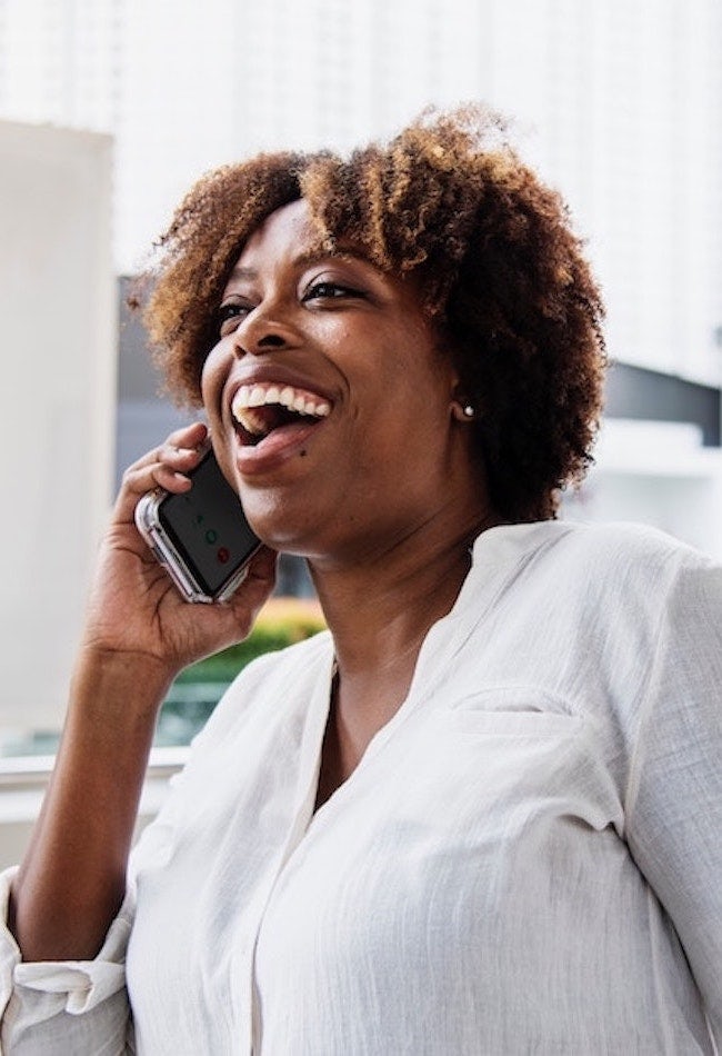Woman laughing on phone