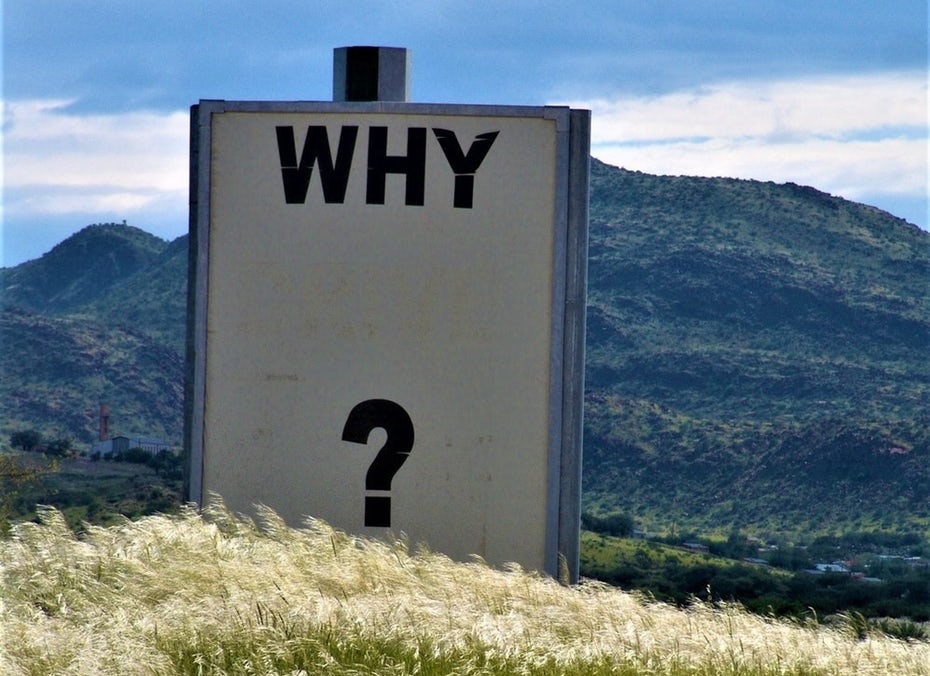 sign in the field saying ‘why?’