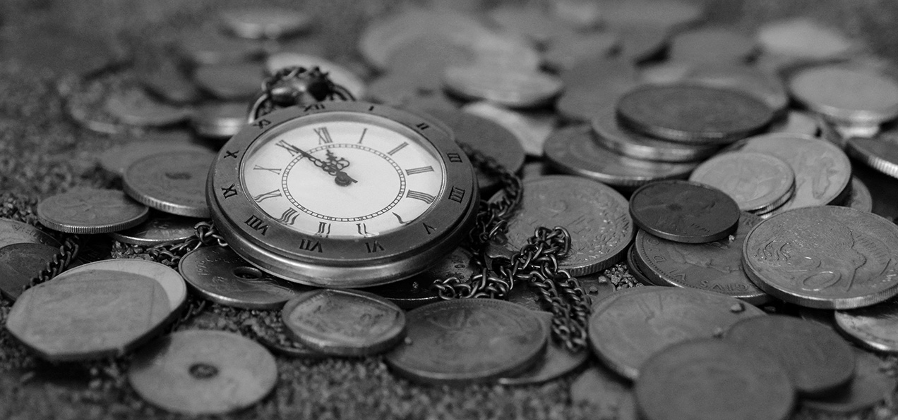 Pocket watch on coins as a metaphor for time being money
